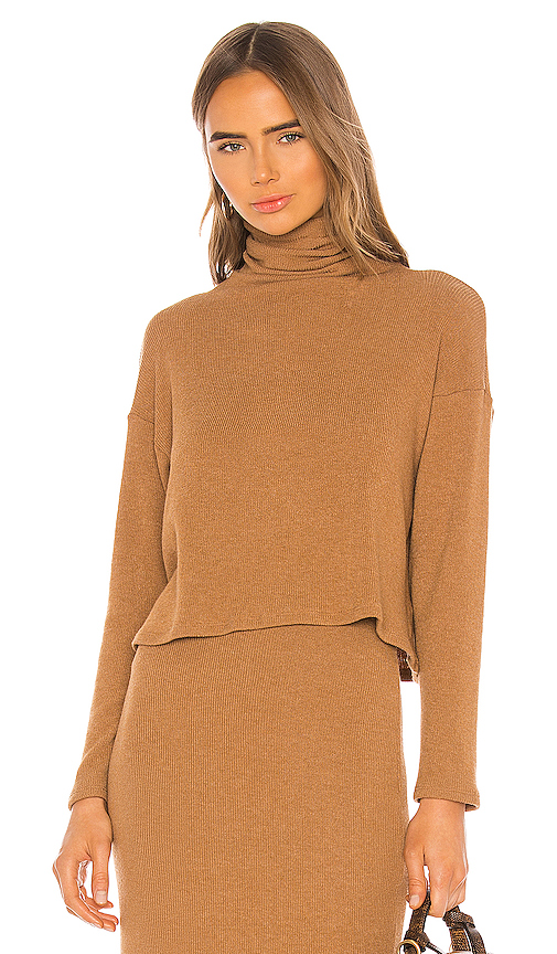 Click to view more detailed imagery on our partner's website Enza Costa Sweater Knit Cropped Long Sleeve Turtleneck In Amber